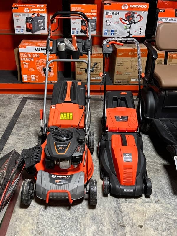 Home Ushttps://images. oe Lawn Mower Machine/ Manual Lawn Mower Machine 1