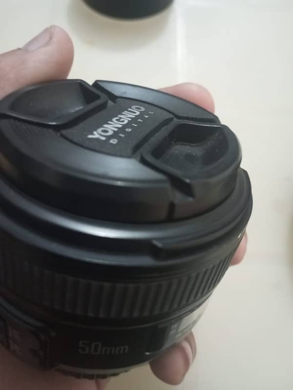 Nikon 50mm , Nikon 18:55 different prices 13