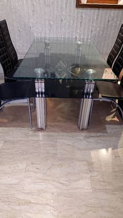 6 person stylish glass dining table with multiple levels.