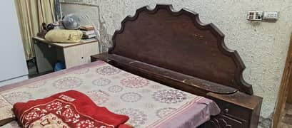 wooden bed with mattress