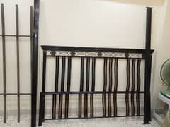 Kind size iron bed