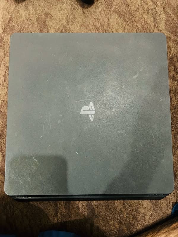 Playstation 4 slim 1TB with 2 original controllers and digital games 5