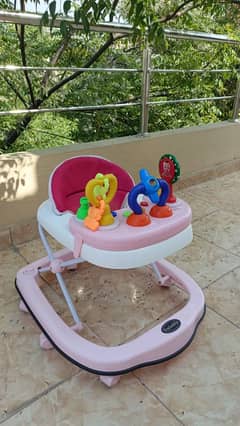 imported baby walker slightly used. music try toys remove able try