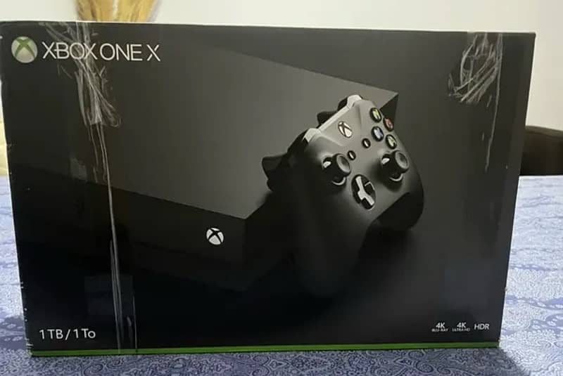 xbox one x 1 TB with Box Disc USA version 0