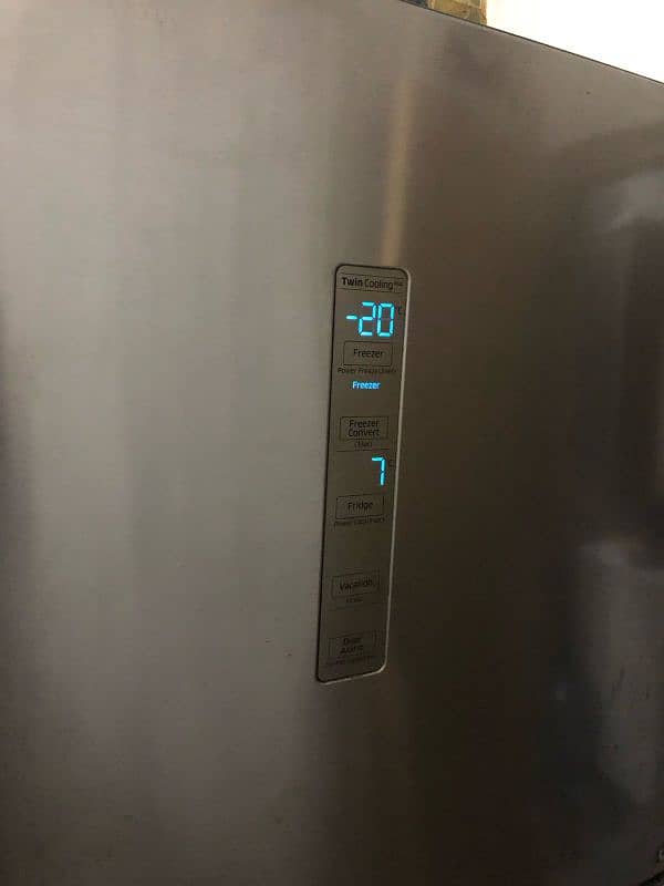 lg and Samsung Fridge two piece refrigerator full size invert with war 6