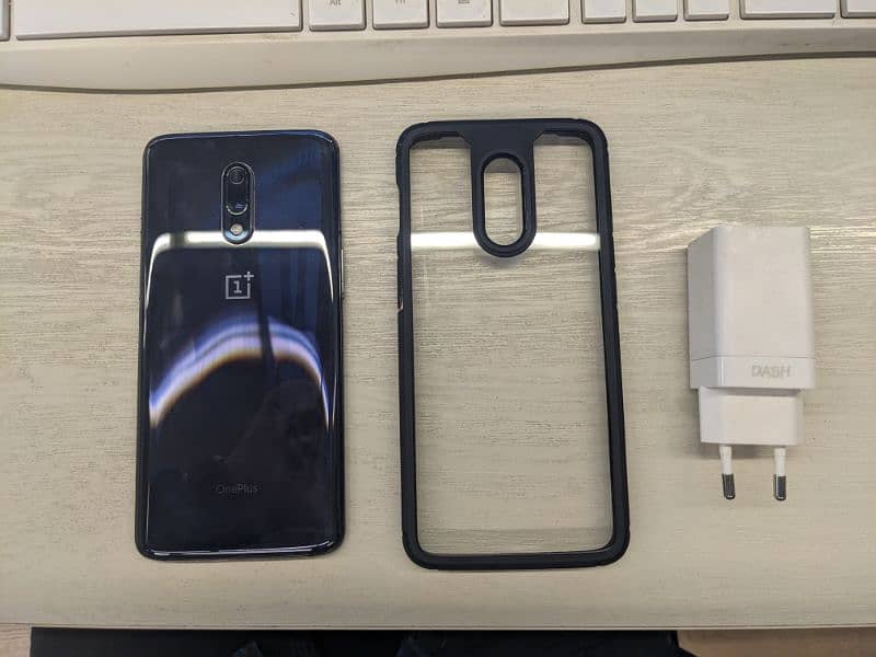 One Plus 7 phone with original charger and cover 1