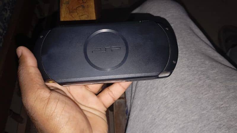 Sony PlayStation Portable (PSP) Street, a handheld gaming console. 0
