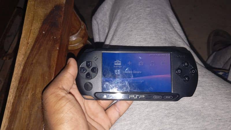 Sony PlayStation Portable (PSP) Street, a handheld gaming console. 1