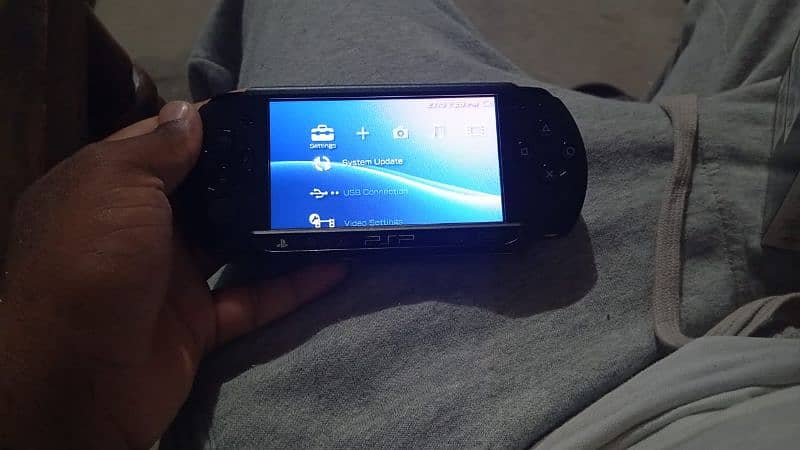 Sony PlayStation Portable (PSP) Street, a handheld gaming console. 3