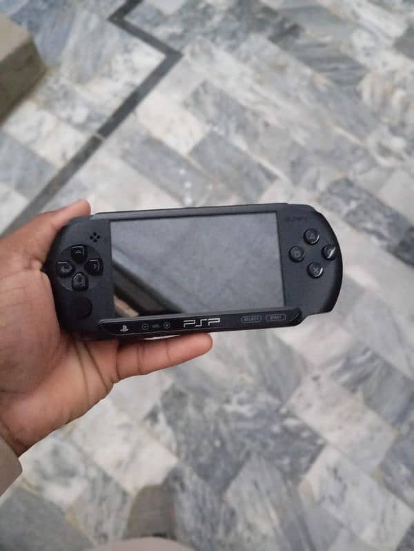 Sony PlayStation Portable (PSP) Street, a handheld gaming console. 8