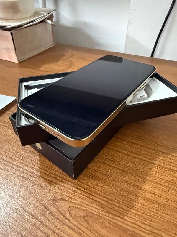 iphone 13 pro max 128gb golden like new. factory unlock and pta approv 5