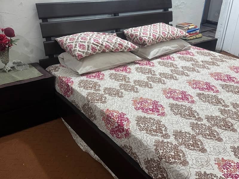 Wooden bed and side tables 0