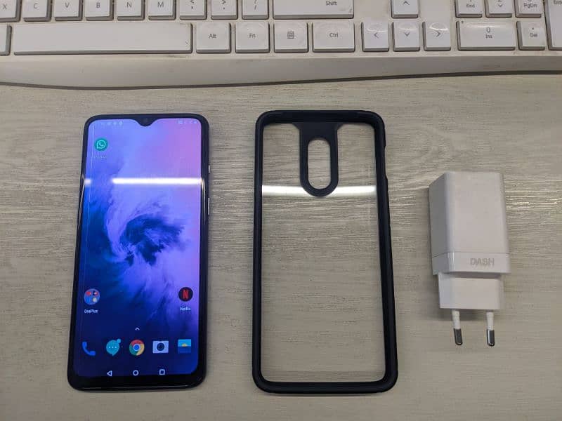One Plus 7 phone with original charger and cover 0