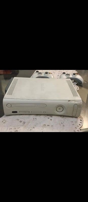 Xbox 360 with 2 original controllers. 1