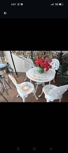 Outdoor chairs and table,Vintage seating,Elegant outdoor seating