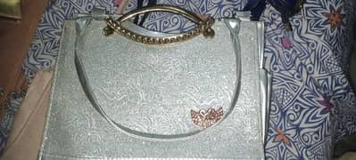 silver colour handbag