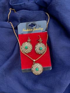 1 pc. earrings with necklace.