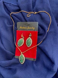 a set of earrings and necklace.