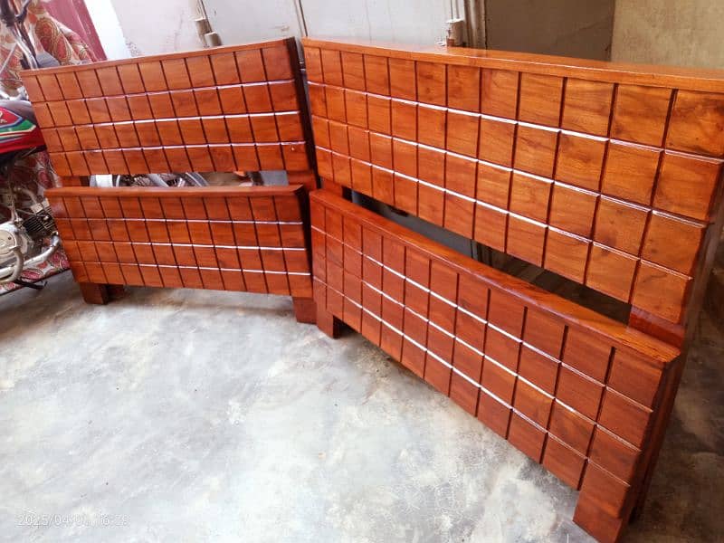 2 wooden single beds 1