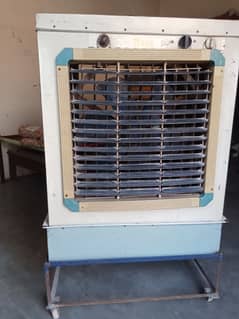 Air cooler in good condition with stand (troli) Rs. 10000