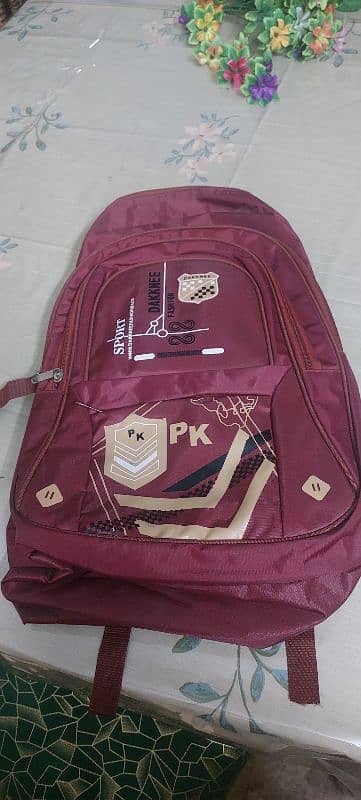 2 new burgundy laptop backpack 5 zips 2 water bottle spaces on sides 0