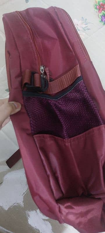 2 new burgundy laptop backpack 5 zips 2 water bottle spaces on sides 1