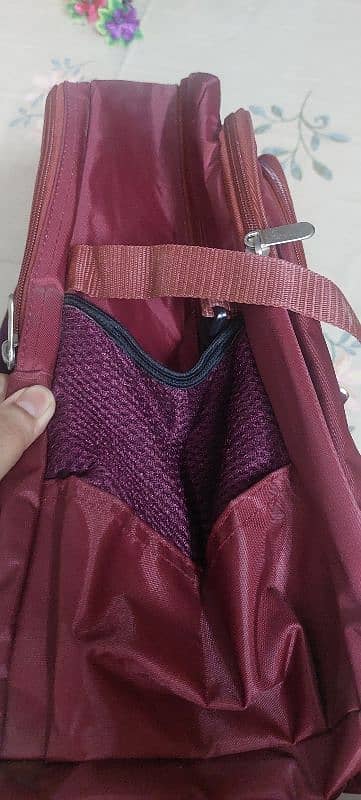 2 new burgundy laptop backpack 5 zips 2 water bottle spaces on sides 2