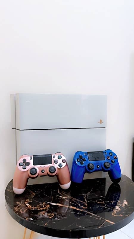 PLAYSTATION 4 with two controllers 0