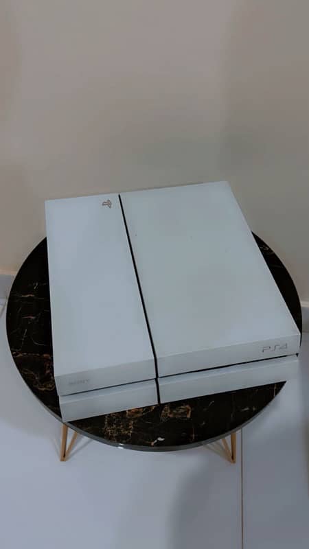 PLAYSTATION 4 with two controllers 1