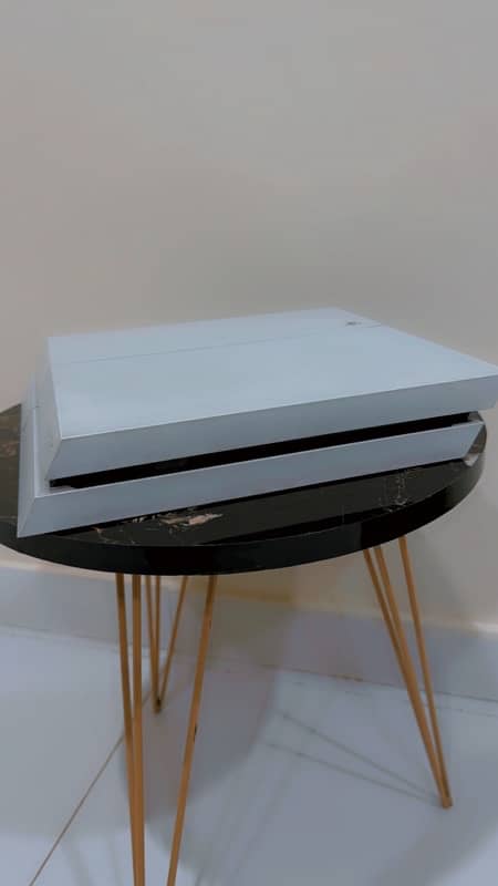 PLAYSTATION 4 with two controllers 2