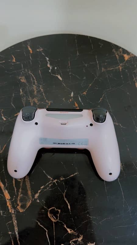 PLAYSTATION 4 with two controllers 9