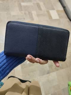 New and used original wallets and a tote bag