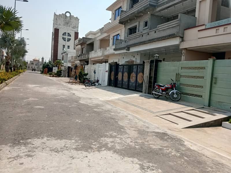 Looking For A Prime Location House In Aziza Housing Scheme 2