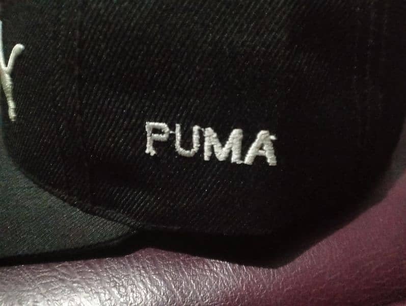 Black Cap written Puma 10