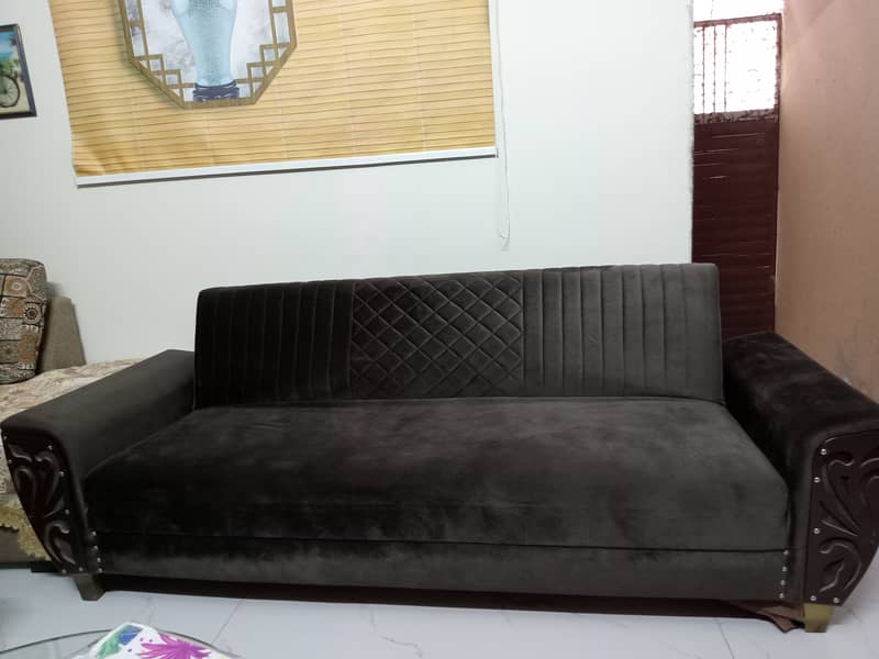 Sofa cum bed in velvet fabric with wooden arms 0