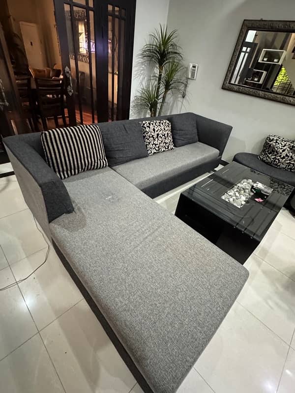 L shaped black and grey sofa 0