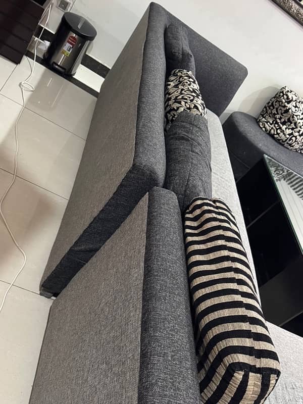 L shaped black and grey sofa 1