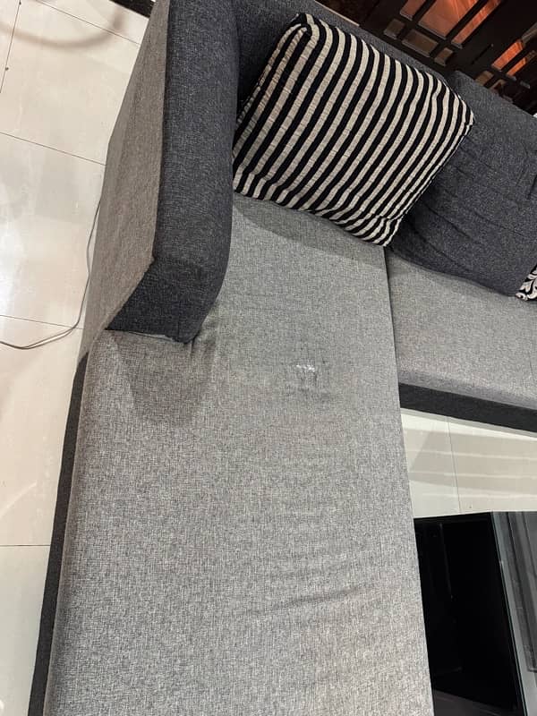 L shaped black and grey sofa 3