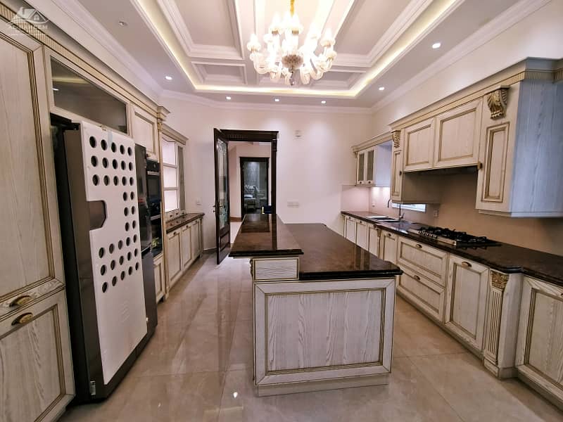 Luxurious 2 Kanal Bungalow with Pool & Theater for Sale in Prime DHA Lahore Location 7