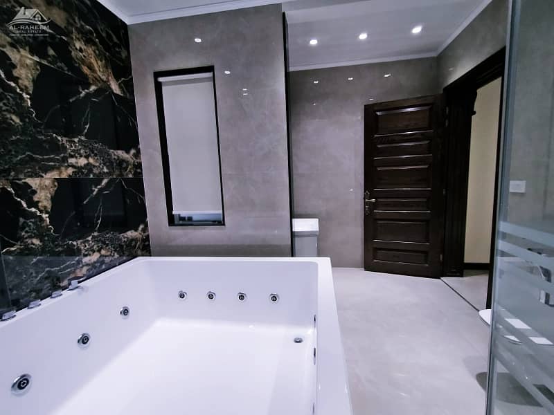 Luxurious 2 Kanal Bungalow with Pool & Theater for Sale in Prime DHA Lahore Location 23