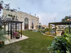 KANAL BUNGLAW KANAL LAWN FULL BASEMENT FULLY FURNISHED PLUS SWIMMING POOL HOME CENIMA LIFT AND MANY OTHER AMENITIES BANGALOW FOR SALE NEAR TO MCDONALDS.