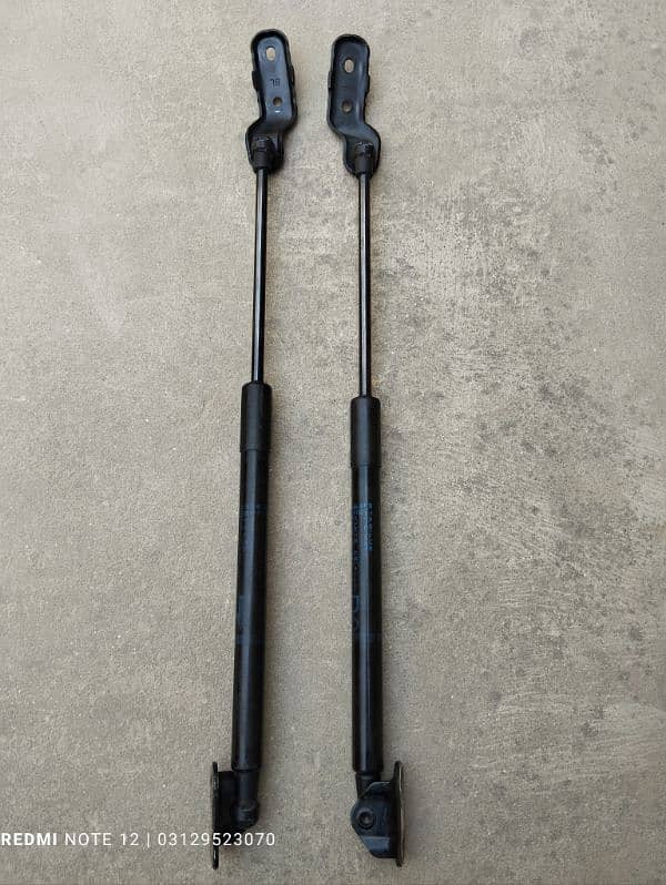 Toyota Vitz Rear Trunk Shock Japanese Available 0