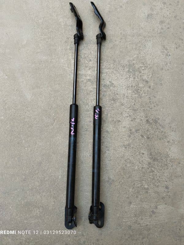 Toyota Vitz Rear Trunk Shock Japanese Available 1