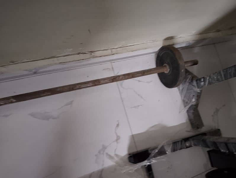 5ft Barbell rod with 4 kg weights on each side 0