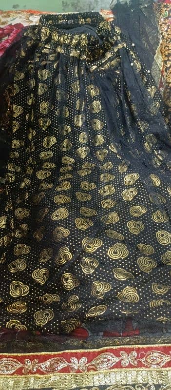 new lehnga in black colour only one time used 5