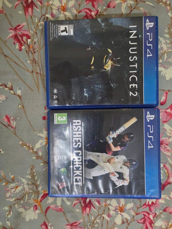 PS4 with 2 controls and 2 games 1