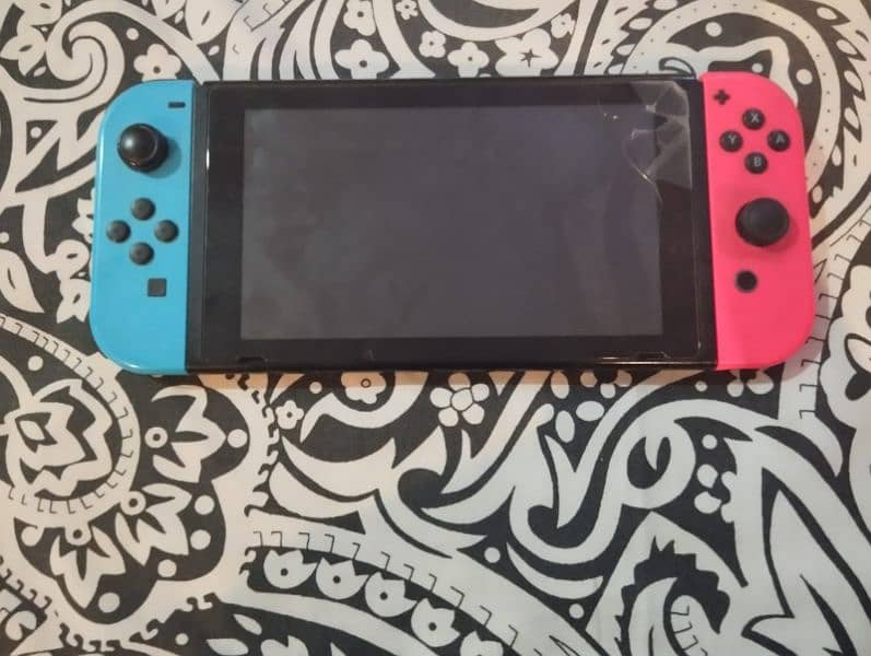 nintendo switch with cover case and games 0