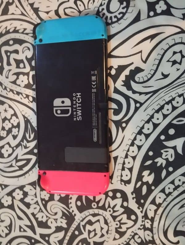 nintendo switch with cover case and games 1