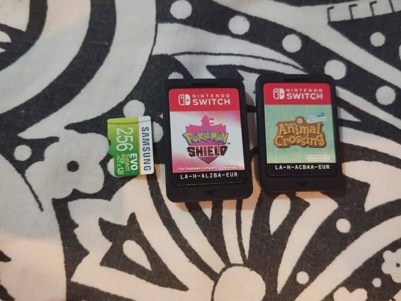 nintendo switch with cover case and games 2