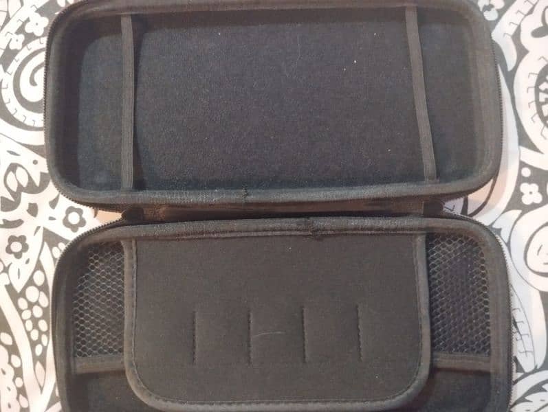 nintendo switch with cover case and games 3